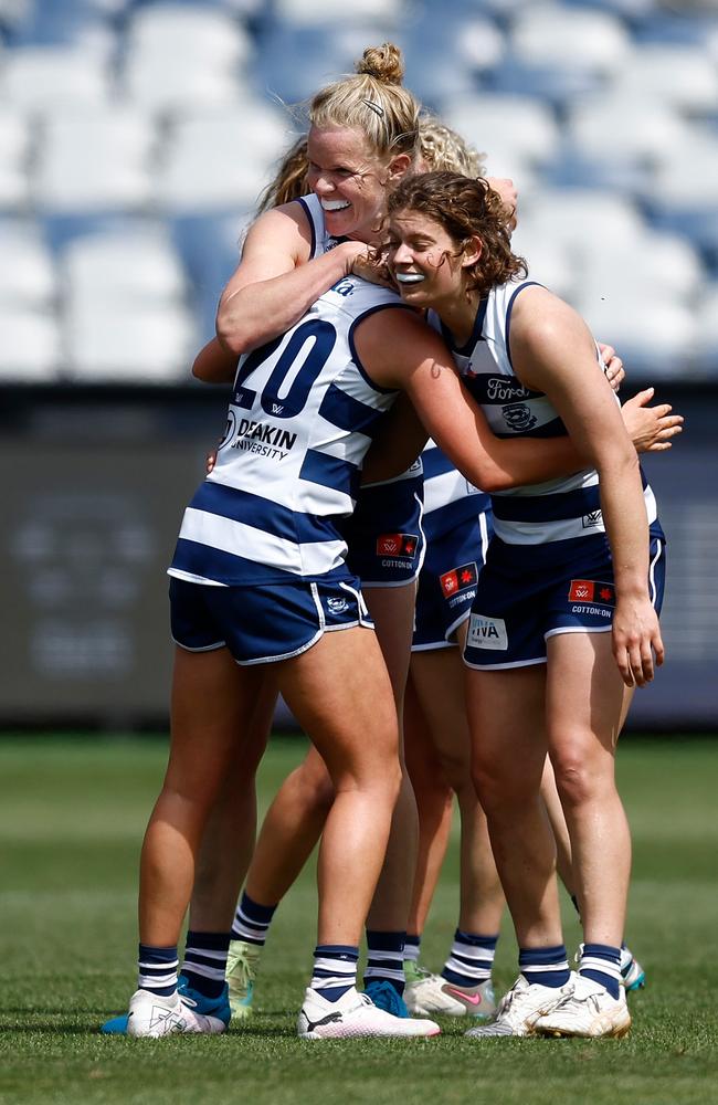 Zali Friswell, Kate Darby and Nina Morrison of the Cats celebrate a goal during their win over Brisbane. Picture: Michael Willson/AFL Photos via Getty Images.