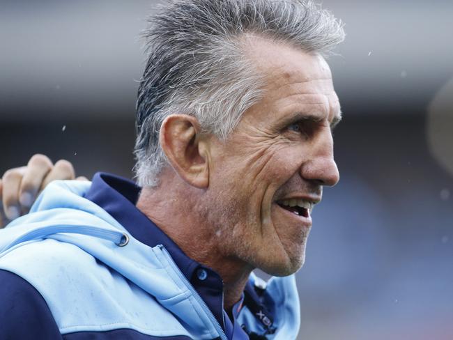 Waratahs coach Rob Penney watches players warm up before the Round 2 Super Rugby match between the New South Wales Waratahs and the Auckland Blues at McDonald Jones Stadium in Newcastle, Saturday, February 8, 2020. (AAP Image/Darren Pateman) NO ARCHIVING, EDITORIAL USE ONLY