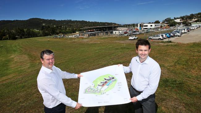 Traders In Purple CEO Brett Robinson and Kingborough Mayor Dean Winter with the master plan concept for the Kingston High School site redevelopment. Picture: CHRIS KIDD