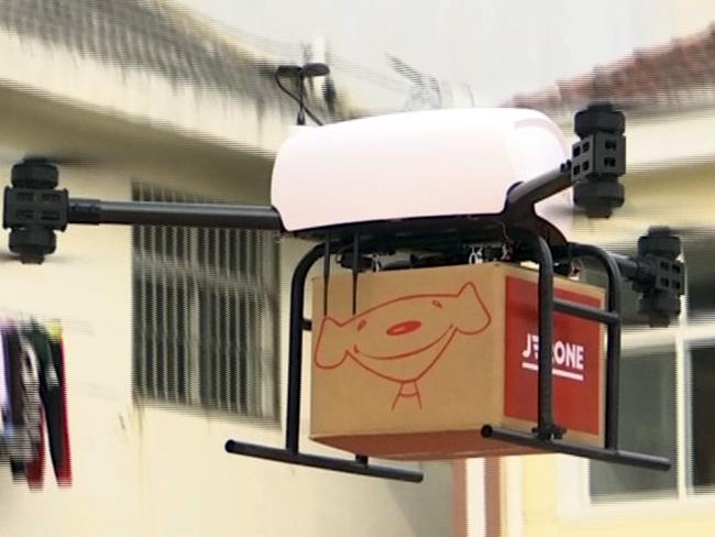 In this image taken from a Nov. 9, 2016 video footage by AP Video, a drone takes off to deliver JD.com parcel from Tiantong'an village near Suqian city in eastern China's Jiangsu province. China's biggest online retailer, JD.com Inc., announced plans Monday, May 22, 2017 to develop drone aircraft capable of carrying a ton or more for long-distance deliveries. (AP Video via AP)