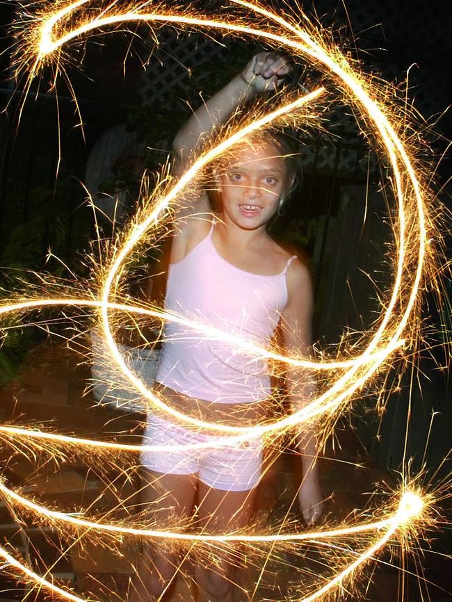 31 Dec 2003 New Year's Eve celebrations in Brisbane - Chloe Barnes with sparklers PicGlenn/Barnes - children illuminations