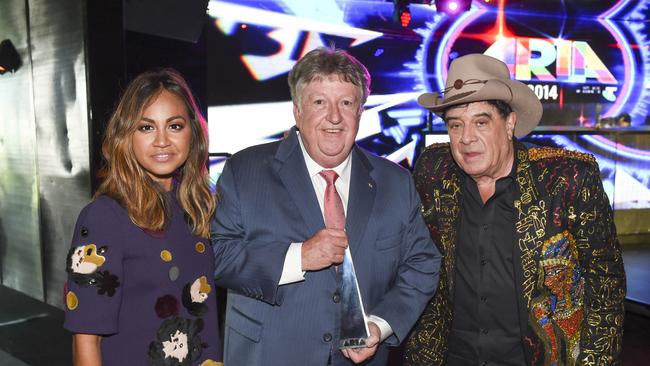 Former Sony Music Australia CEO Denis Handlin (centre) with pop singer Jessica Mauboy and Molly Meldrum at the ARIA Awards in Sydney on November 26 2014, after Handlin had been presented with an ‘industry icon’ award.