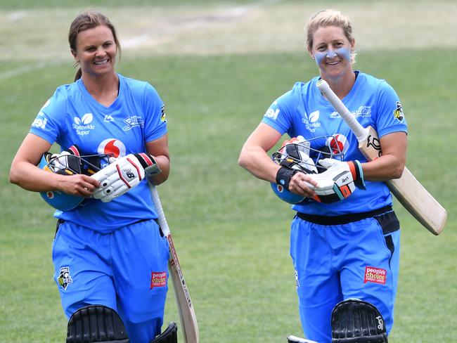 Strikers openers Suzie Bates and Sophie Devine walk from the field after their super over win in the WBBL match against Sydney Thunder at Blundstone Arena in Hobart. Picture: AAP IMAGE/DAVID MARIUZ