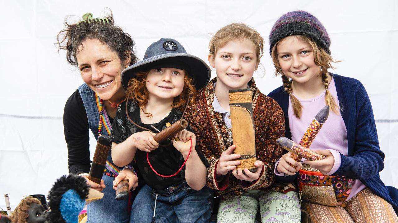 Lizzie Phillips with her kids (from left) Florian, Rosa-Mae and Ruby-Jean Phillips in the Children's Circle at World Environment Day Toowoomba celebrations at wet weather venue Rangeville State School. Picture: Kevin Farmer