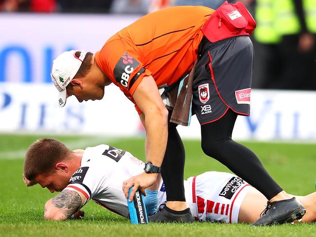 SYDNEY, AUSTRALIA - AUGUST 26: Euan Aitken of the Dragons looks dejected as he receives attention from the trainer during the round 24 NRL match between the St George Illawarra Dragons and the Canterbury Bulldogs at UOW Jubilee Oval on August 26, 2018 in Sydney, Australia. (Photo by Mark Kolbe/Getty Images)