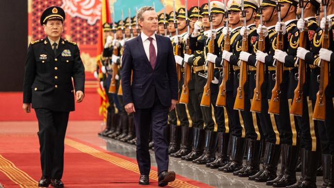 Christopher Pyne and his Chinese counterpart, Wei Fenghe, inspect solders of the People’s Liberation Army in Beijing. Picture: Li Xiaonan