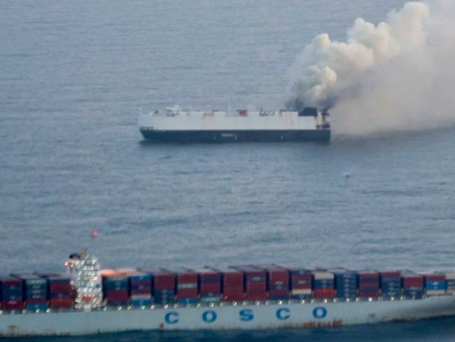 In this photo provided by the U.S. Coast Guard, smoke rises from cargo vessel Morning Midas approximately 300 miles south of Adak, Alaska, June 3, 2025, as the crew of a cargo ship carrying about 3,000 vehicles to Mexico, abandoned ship after they could not control a fire. (U.S. Coast Guard/Courtesy of Air Station Kodiak via AP)
