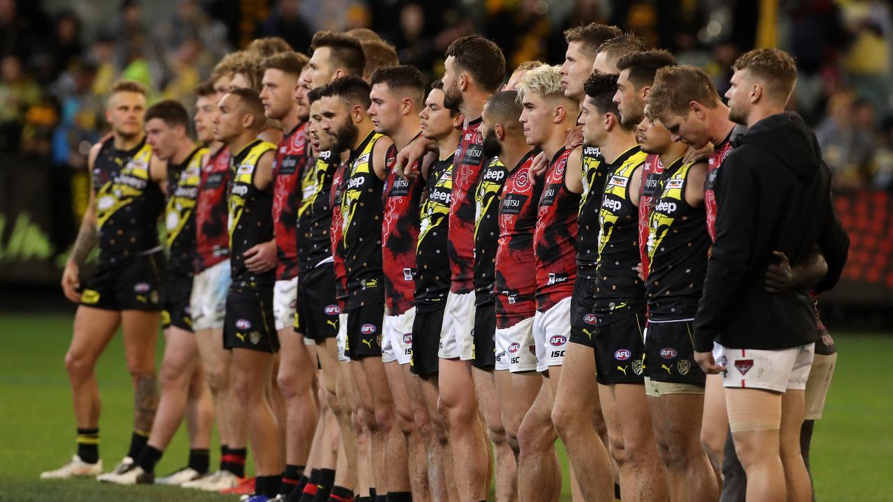 Essendon and Richmond players ahead of the 2019 Dreamtime game. Picture: AAP Image/Mark Dadswell