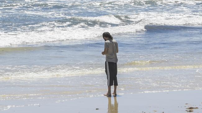 A man defies the lockdown at Adelaide’s Glenelg Beach on Thursday, while most South Australians remained inside. Picture: Getty Images