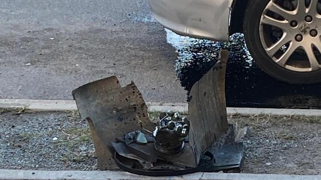 Oil spews on to City Rd from the dumped silver Peugeot.