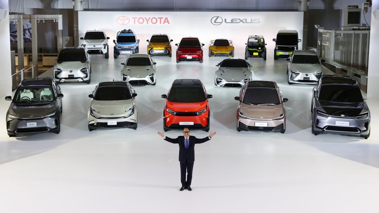 Toyota president Akio Toyoda with the brand’s upcoming electric cars.