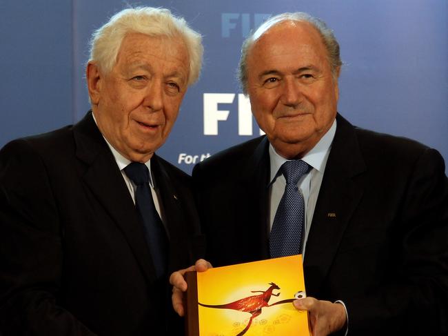 ZURICH, SWITZERLAND - MAY 14: Frank Lowy, FFA Chairman hands Australia's Bid book to Sepp Blatter, President of FIFA during the 2018/2022 World Cup Bid Book Handover ceremony at FIFA Headquarters on May 14, 2010 in Zurich, Switzerland. (Photo by Ross Kinnaird/Getty Images)