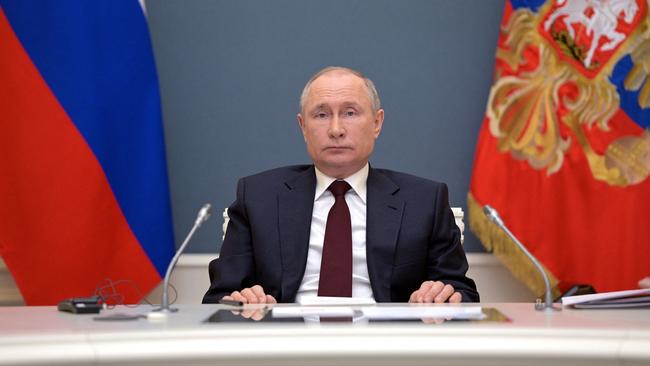 Russian President Vladimir Putin attends from his residence in Moscow.