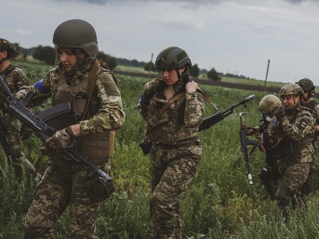 The women had to learn how to handle guns and their equipment while in the combat zone. Picture: Ercin Erturk/Anadolu Agency via Getty Images