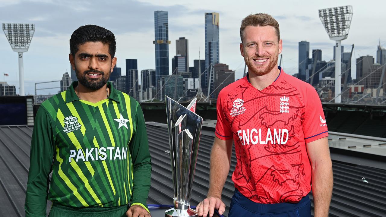 Babar Azam andf Jos Buttler with the T20 World Cup trophy on the MCG roof.