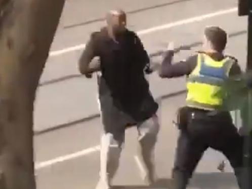 explosions have rocked Bourke St and city streets in lockdown after a car fire and possible attack by man with knife. Twitter screen grabs of a man in an altercation with police.