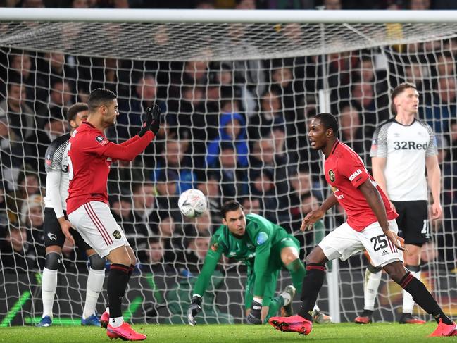 DERBY, ENGLAND - MARCH 05: Odion Ighalo of Manchester United celebrates after scoring his sides third goal with Andreas Pereira during the FA Cup Fifth Round match between Derby County and Manchester United at Pride Park on March 05, 2020 in Derby, England. (Photo by Michael Regan/Getty Images)