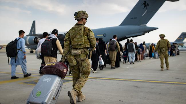 Australian citizens and visa holders board a Royal Australian Air Force aircraft in August at Hamid Karzai International Airport, Kabul, Afghanistan.