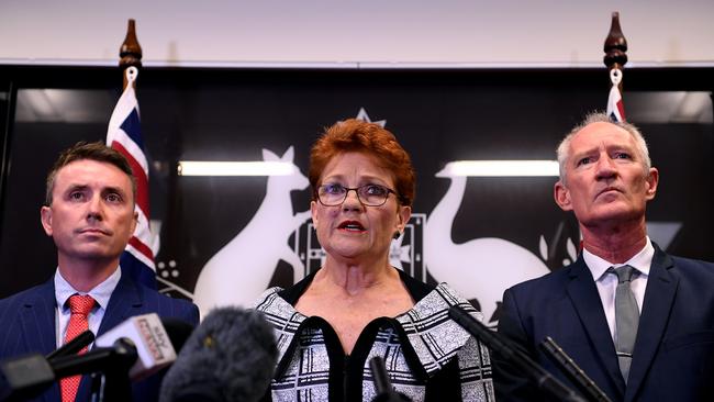 Queensland Senator and One Nation leader Pauline Hanson flanked by party officials James Ashby (left) and Steve Dickson. AAP Image/Dan Peled.