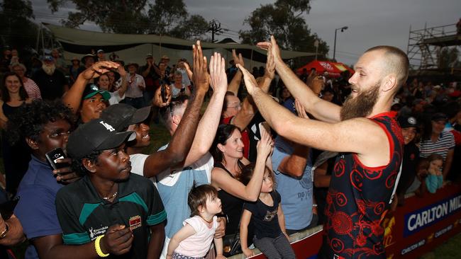 New Melbourne skipper Max Gawn celebrates with fans after the Demons beat Adelaide in their 2018 match at TIO Traeger Park in Alice Springs. Picture: Michael Willson/AFL Media/Getty Images