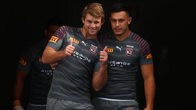 GOLD COAST, AUSTRALIA - JUNE 03: Christian Welch and Tino Fa'asuamaleaui walk out for the start of a Queensland Maroons State of Origin training session at Cbus Super Stadium on June 03, 2021 in Gold Coast, Australia. (Photo by Chris Hyde/Getty Images)