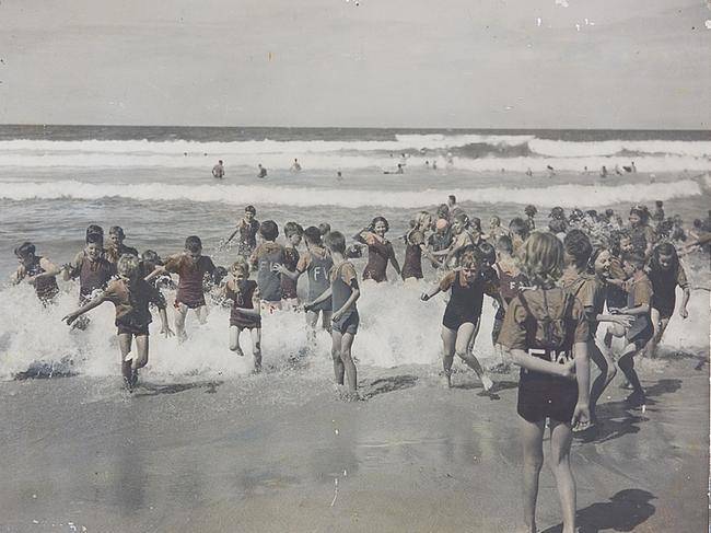 Country children who attended the early days of what was then called the Far West Children's Scheme, have fun at Manly Beach during a respite holiday camp.