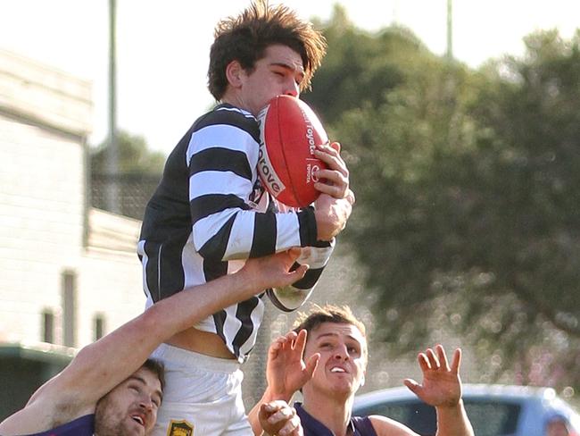 RDFL footy: Diggers Rest v Wallan. Wallan's Nathan Fowler flies high for a big mark. Picture: Aaron Cook (must credit)