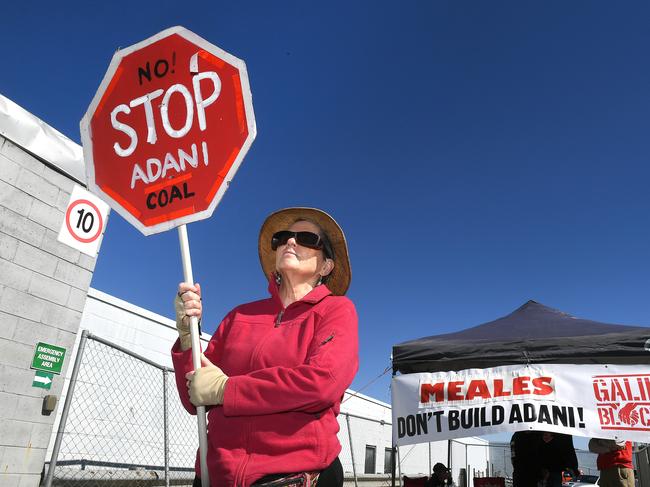 Protesters at the site of an Adani contractor. Picture: John Gass/AAP