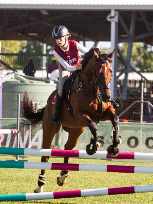 Madison Robertson and Prince Dat at the PQC State Showjumping Championships 2023.