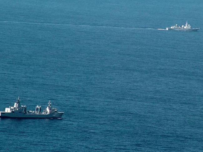 The Yuhengxing spent three weeks travelling south along Australia’s coast, monitoring a number of sensitive military installations. The other ship is HMAS Supply. Picture: Australian Department of Defence