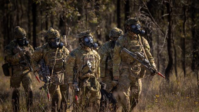 Australian army soldiers from the 3rd Battalion, Royal Australian Regiment, conduct a stretcher carry during the 2022 Duke of Gloucester Cup in Singleton. *** Local Caption *** Australian Army infantry soldiers from across Australia tested their core skills for the prestigious Duke of Gloucester Cup at the School of Infantry, near Singleton in NSW, July 31 - August 5 2022. The Duke of Gloucester Cup is the Armyâ€™s premier military skills competition, pitting the best Royal Australian Corps of Infantry rifle sections from each unit against one another through a series of challenging activities that test their core infantry skills, including marksmanship, tactics, teamwork and fitness. Along with the Duke of Gloucester Cup, five other trophies are awarded: Sir Arthur MacDonald Trophy for best foundation war-fighting skills; Gurkha Trophy for best live-fire shooting; Royal Ulster Rifles Trophy for best falling plate shooting; OSCMAR Trophy for best battle endurance; and the DSM Roche CSC Memorial Cup for best individual soldier. The Duke of Gloucester Cup was created by Prince Henry, Duke of Gloucester, in 1946, while serving as the Governor-General of Australia.