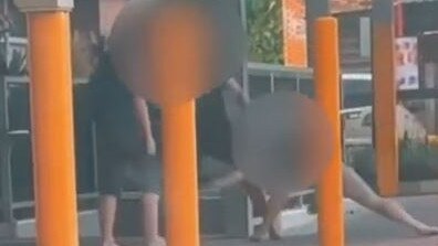 A pair has been caught on camera viciously attacking each other outside the Nambour Train Station.