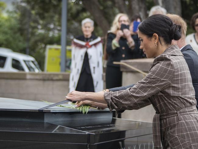 Meghan and Harry lay ferns and a wreath at the Tomb of the Unknown Warrior. Picture: Getty