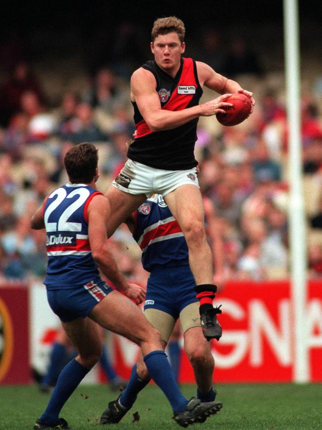 … And Cummings in his playing days at Essendon. 