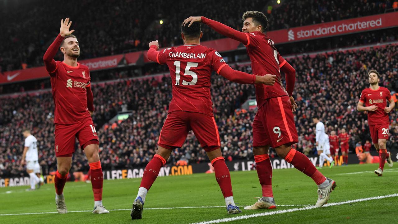 Liverpool celebrate Alex Oxlade-Chamberlain’s goal. (Photo by Paul ELLIS / AFP)
