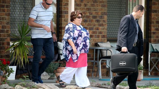 Police escort Sharon Tarrant from a house in Lawrence after a search. Picture: Nathan Edwards