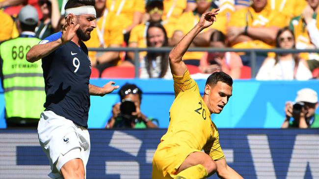 Trent Sainsbury wins a challenge against Olivier Giroud. Picture: AAP