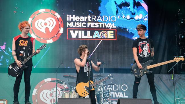 FILE --In this Sept. 20, 2014 file photo, 5 Seconds of Summer performs at the iHeartRadio Music Festival Village in Las Vegas. Breakthrough newcomers Sam Smith and 5 Seconds of Summer will take the stage at the 2014 American Music Awards. Dick clark productions announced Thursday, Oct. 23, 2014, that Mary J. Blige will join the British pop crooner and Australian boy band at the at the Nov. 23 event at Nokia Theatre L.A. Live, to air live on ABC. (Photo by Al Powers/Powers Imagery/Invision/AP, file)