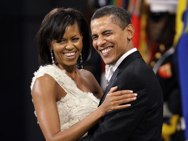 This Jan. 20, 2009 file photo shows President Barack Obama and first lady Michelle Obama as they dance together at the Obama Home States Inaugural Ball in Washington. (AP Photo/Charlie Neibergall, File)