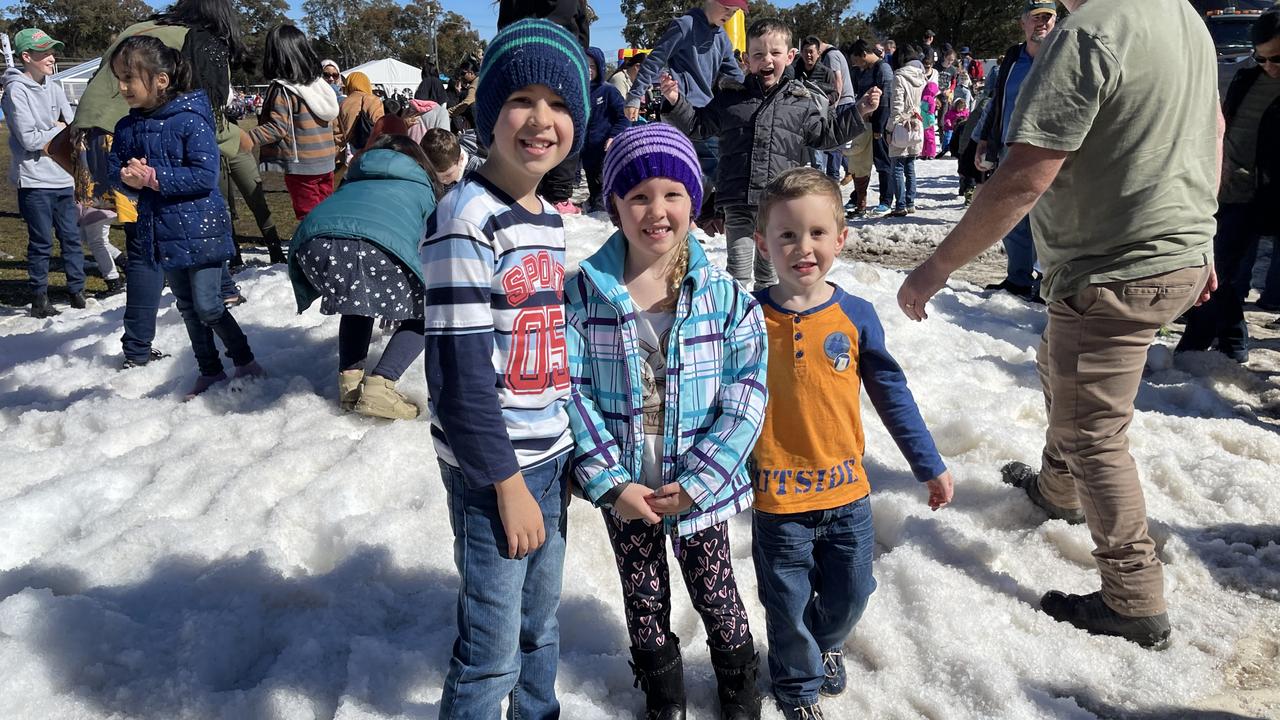 Siblings Elijah (9), Arwen (6) and Noah Brown (5) from Ipswich play in the snow at Snowflakes in Stanthorpe 2021. Photo: Madison Mifsud-Ure / Stanthorpe Border Post