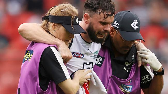 A distraught Williams is helped from the field. Picture: Mark Kolbe/Getty Images