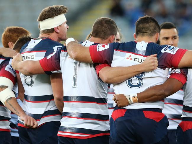 **FILE** A Saturday, April 30, 2016 image reissued Monday, April 10, 2017 of Rebels players at the start of the Round 10 Super Rugby match between the Blues and Melbourne Rebels at Eden Park in Auckland. The Western Force and Melbourne Rebels will learn within three days which of them is to be axed, Australian Rugby Union chairman Cameron Clyne says. It's part of a broader restructure of an unwieldy and unpopular Super Rugby competition format, which is to be slashed from 18 teams to 15 after this season, with two South African sides also to go. (AAP Image/David Rowland) NO ARCHIVING, EDITORIAL USE ONLY