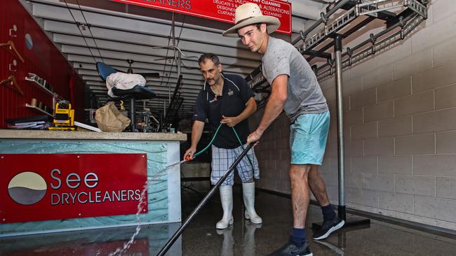 Owner of See Drycleaners in Rosalie Village, Paddington, Tony Frangos cleans up his business alongside Lachie Middendorp. Picture: Zak Simmonds