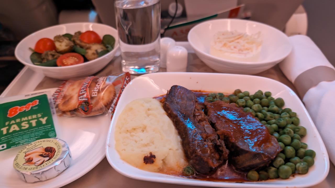 The braised beef cheeks served with potato puree and pees. All their meals are served on Royal Doulton china - like in business class. Picture: news.com.au