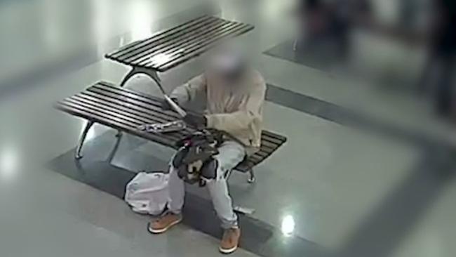 A man is seen in a shopping centre holding a large knife. Picture: NSW Police