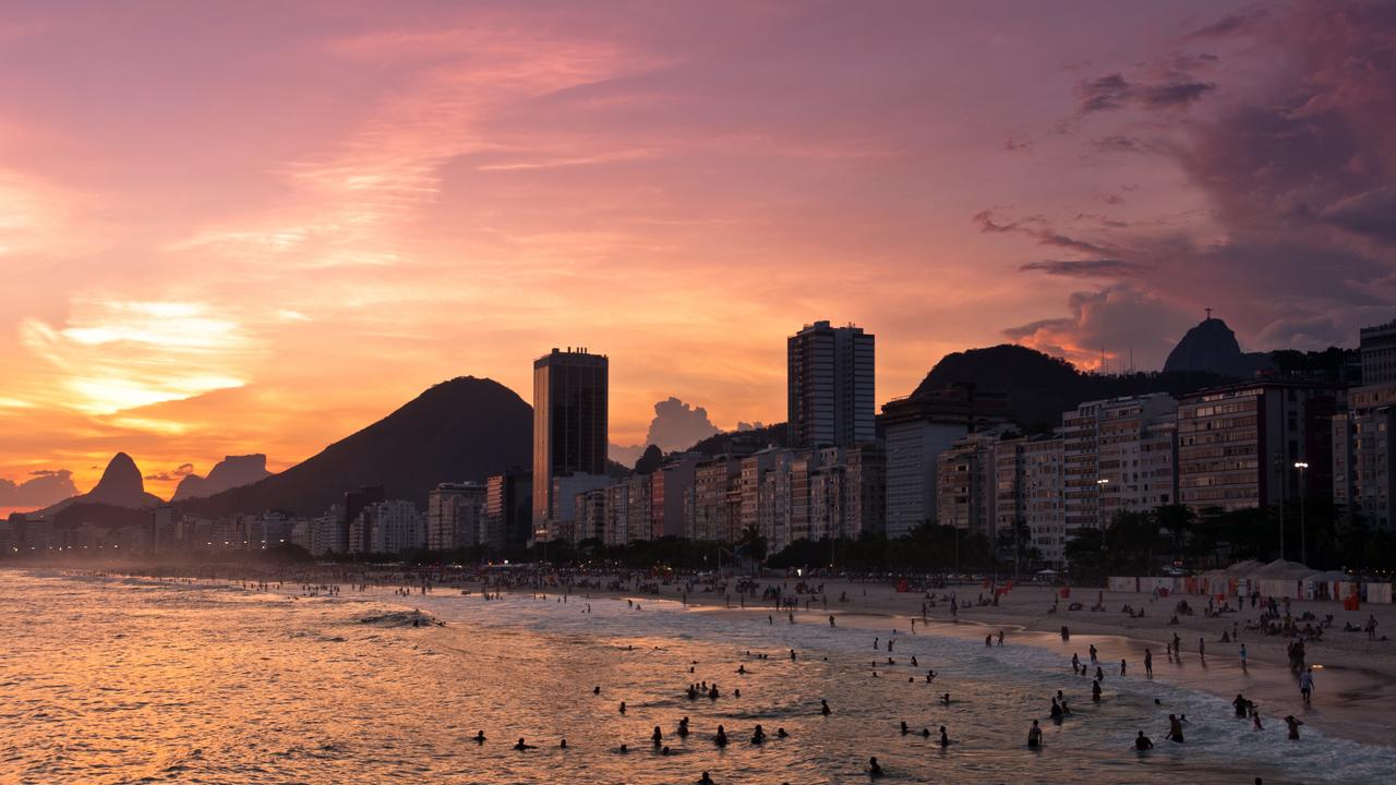 A sunset in Copacabana Beach, Rio de Janeiro, Brazil, a tourist hot spot which is now being marred by crime. Picture: iStock