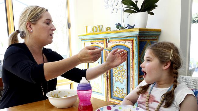 Kingston mum Nicole Cowles uses a cannabinoid tincture to help treat daughter Alice’s seizures. Picture: KIM EISZELE