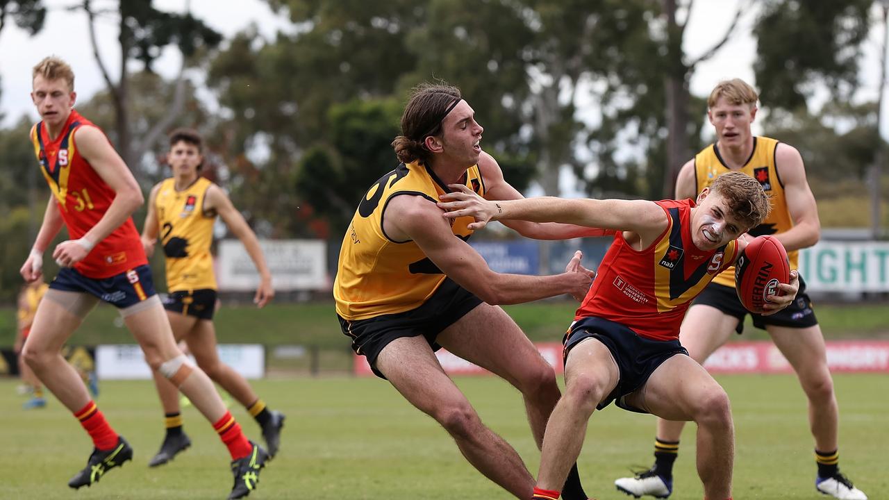 Hugh Jackson breaks from a Rhett Bazzo tackle against Western Australia during his recent NAB AFL U19 Championships game. While South Australia lost, the star midfielder managed to draw a lot of positive attention. Picture: Paul Kane/Getty Images