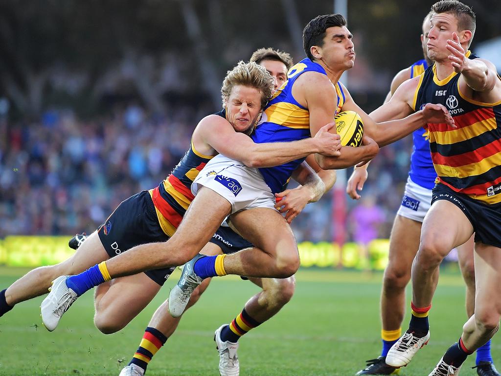 ADELAIDE, AUSTRALIA - JUNE 30: Rory Sloane of the Crows tackles Thomas Cole of the Eagles during the round 15 AFL match between the Adelaide Crows and the West Coast Eagles at Adelaide Oval on June 30, 2018 in Adelaide, Australia.  (Photo by Daniel Kalisz/Getty Images)