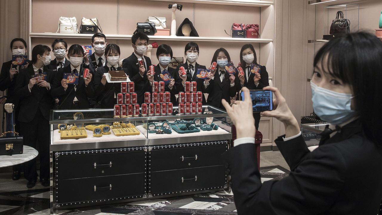 Staff at a Gucci store in Wuhan international plaza. Picture: Getty Images